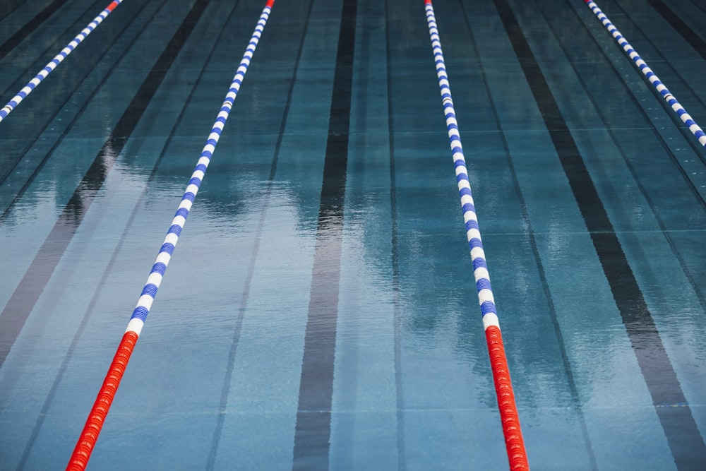 a row of blue and white striped swimming lanes