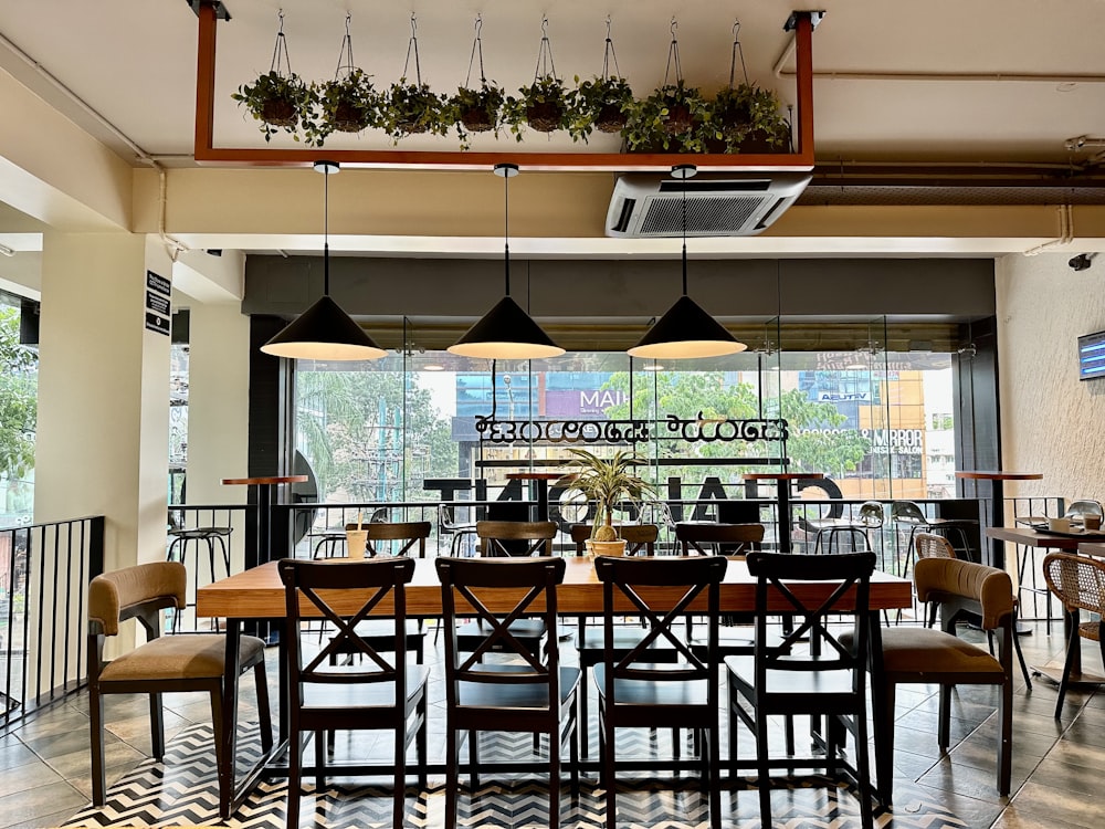 a restaurant with a large table and chairs