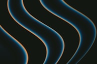 Dark, smooth, wavy lines with a glowing edge move diagonally across a black background. The lines have a blue hue with a hint of orange outlining.