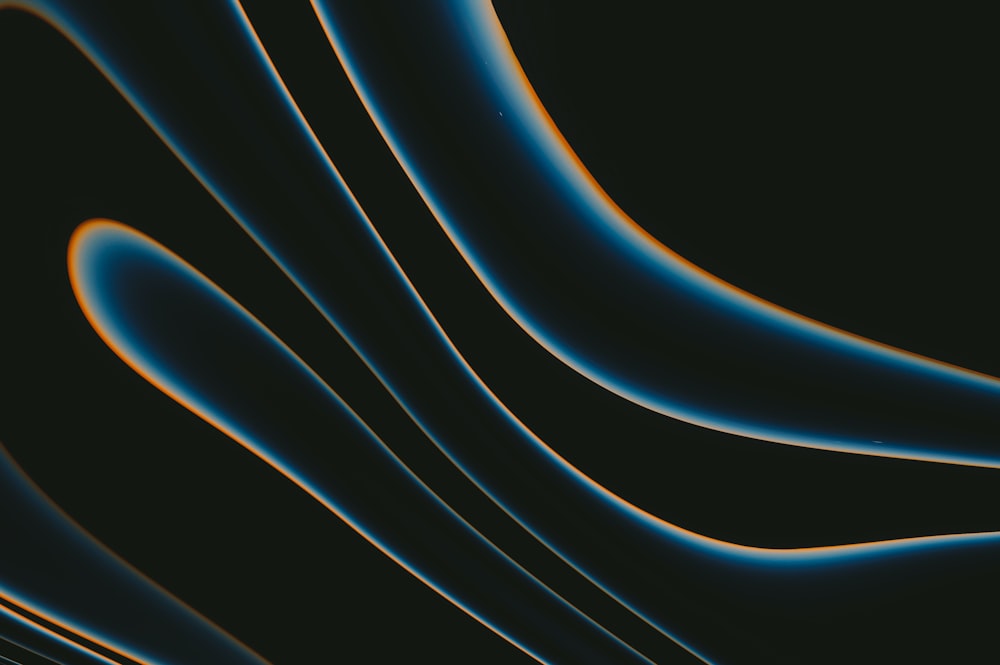 a black background with orange and blue lines