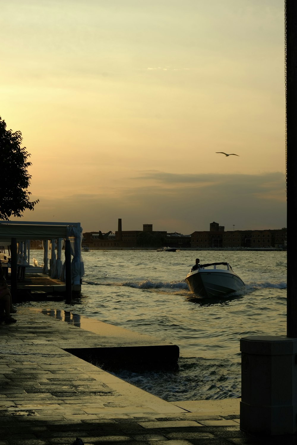 a boat is in the water near a dock