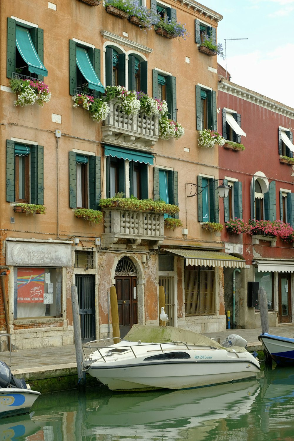 a boat is docked in front of a building