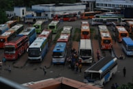 A fleet of buses lined up ready for intercity routes at a terminal