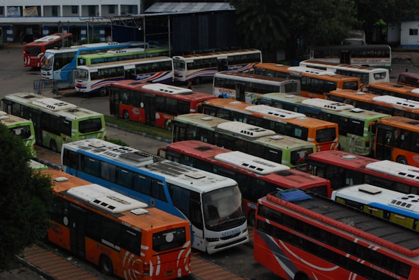A fleet of buses ready for passenger transport.