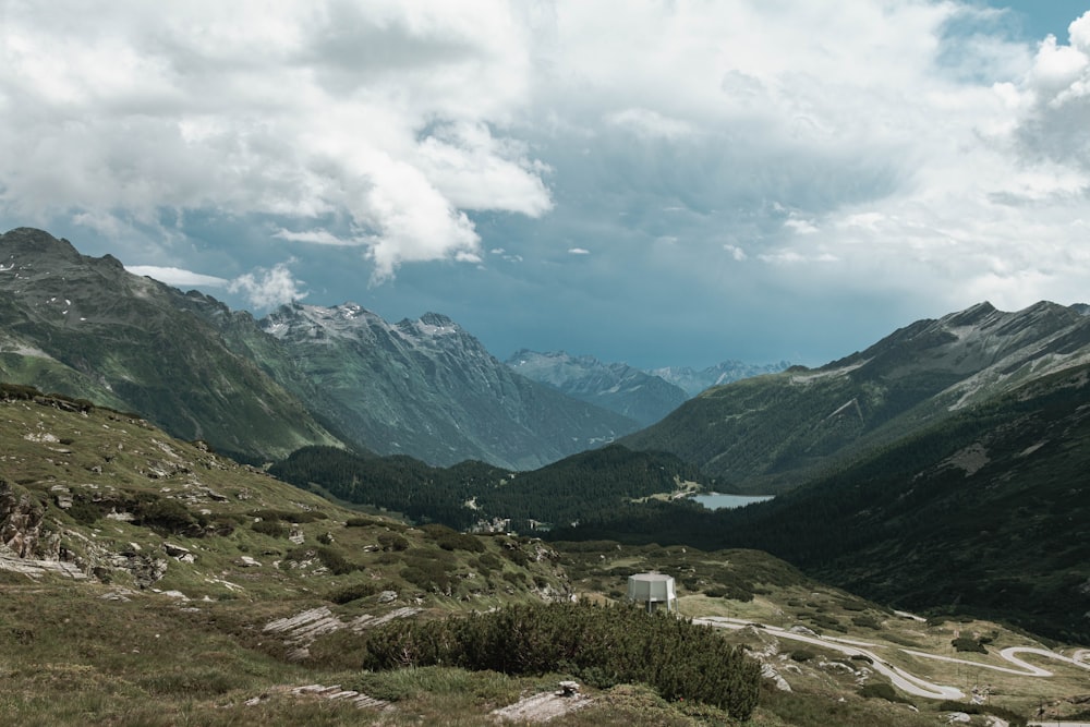 a view of a mountain range with a road going through it