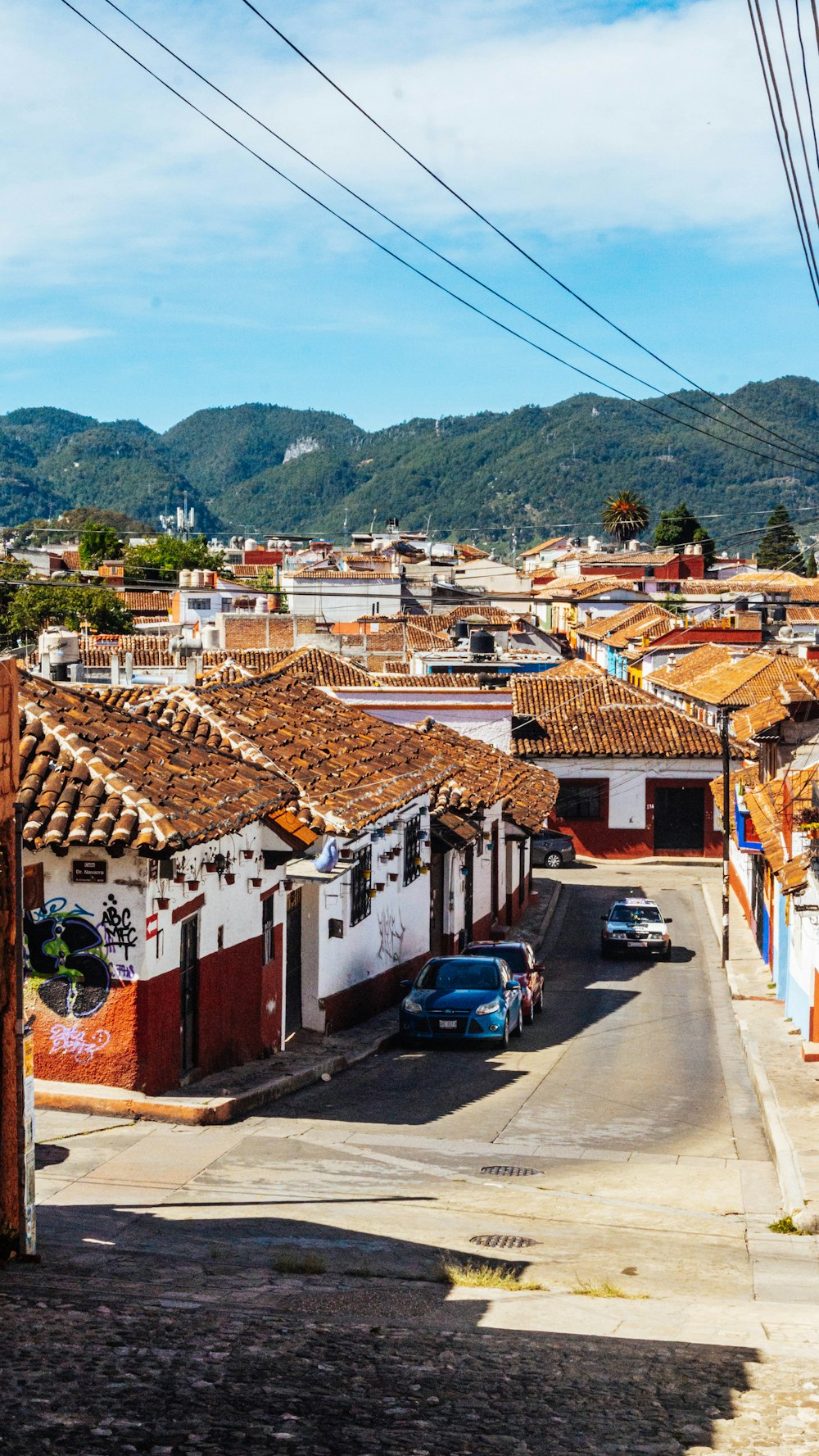 a street with cars parked on the side of it