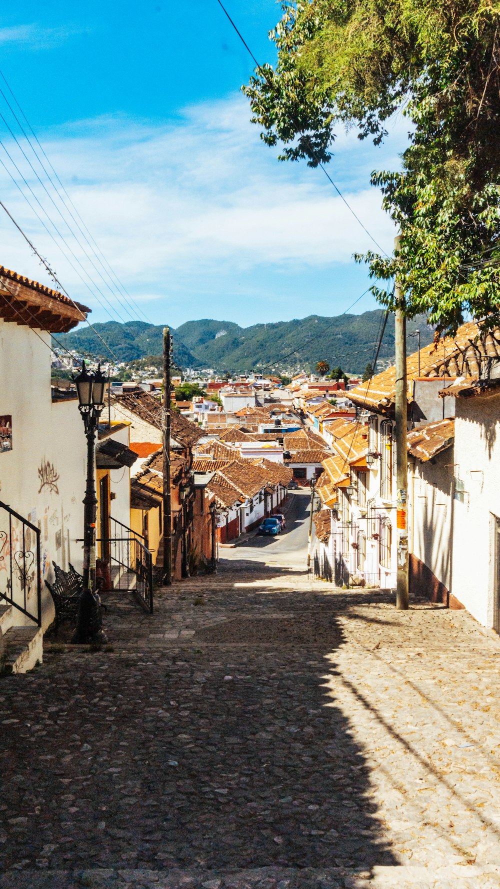 a cobblestone street in a small town