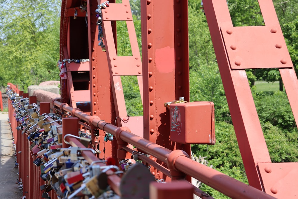 a red bridge with lots of padlocks on it