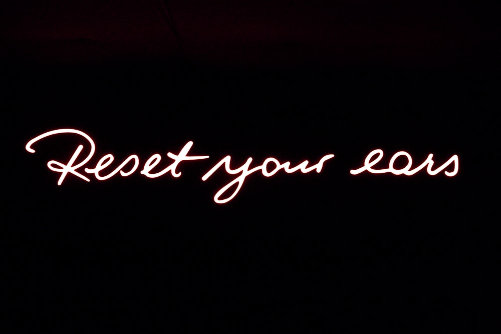 a neon sign that reads rest your legs