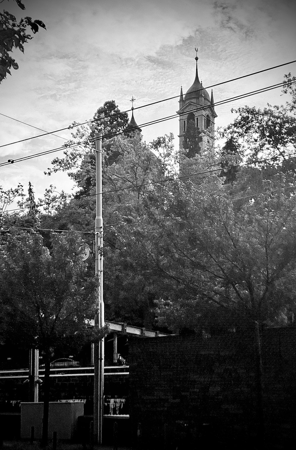 a black and white photo of a clock tower