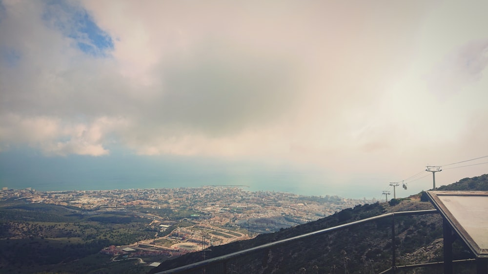 a view of a city from the top of a hill