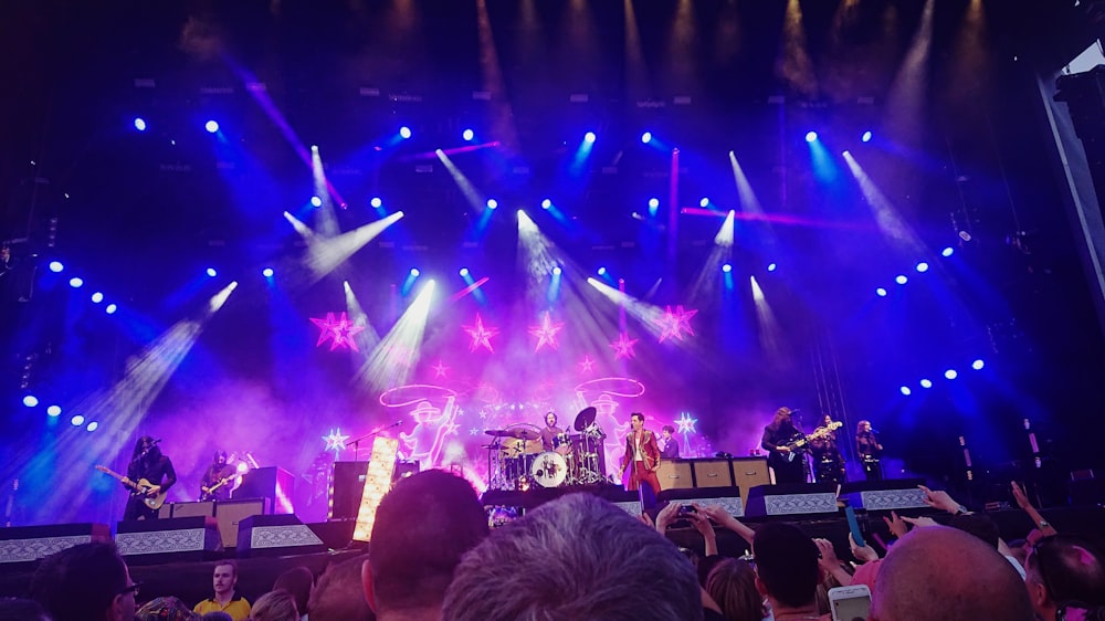 a group of people standing on top of a stage