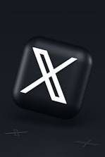 a black button with a white symbol on it