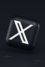 a black button with a white symbol on it