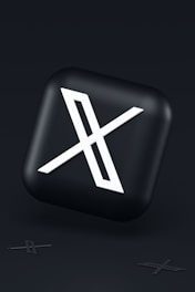 a black button with a white symbol on it
