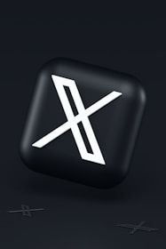a black button with a white symbol on it