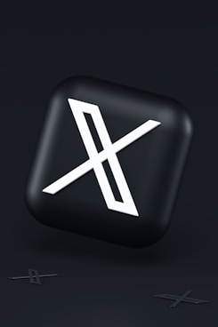 a black button with a white symbol on it