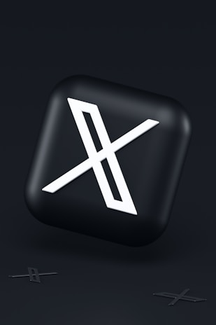 a black button with a white symbol on it