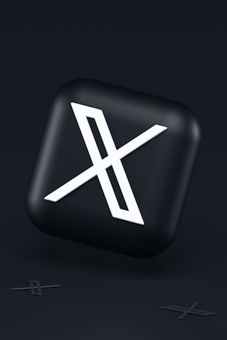 a black button with a white symbol on it