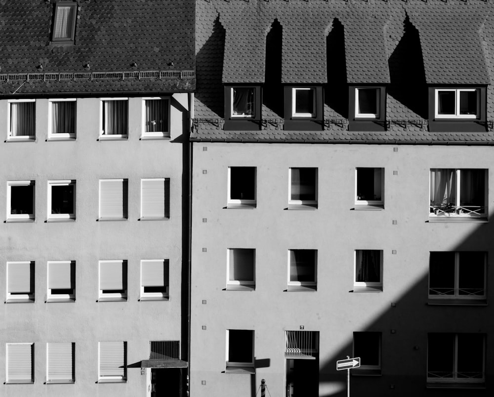 a black and white photo of a building with windows