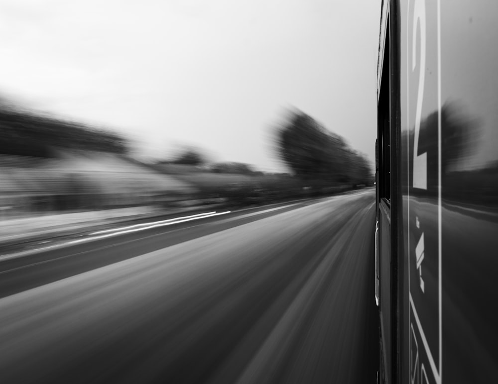 a black and white photo of a highway