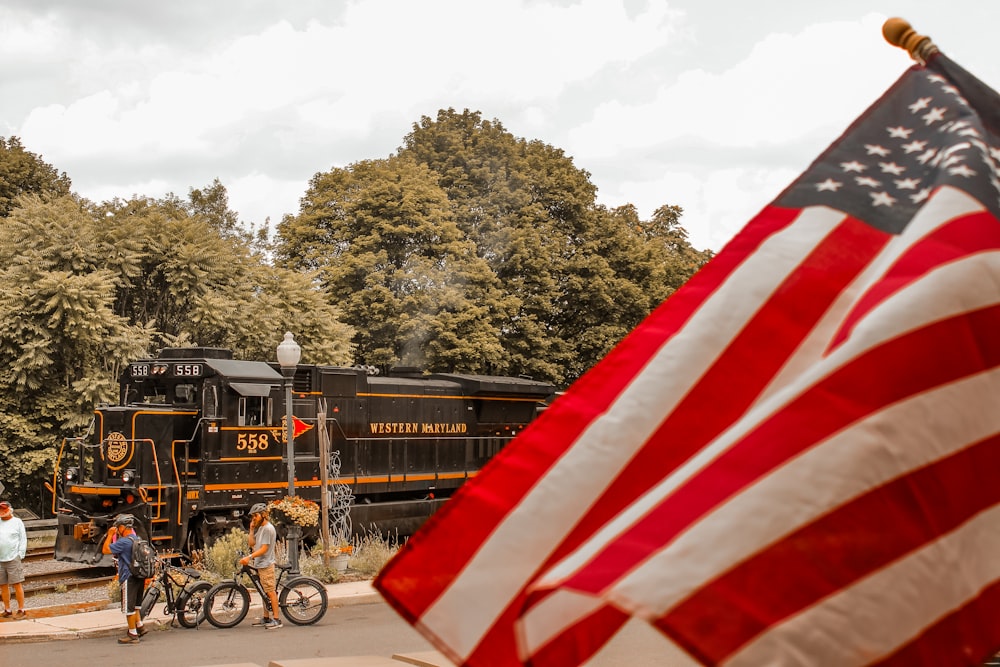 a flag and a train on a train track