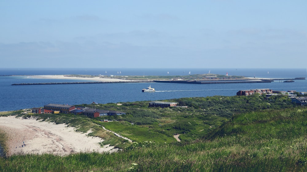 a boat is in the water near a beach