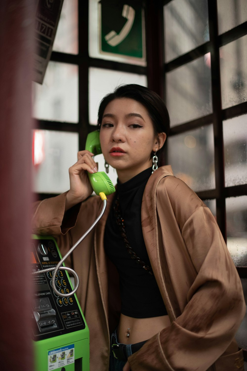 a woman holding a phone up to her ear