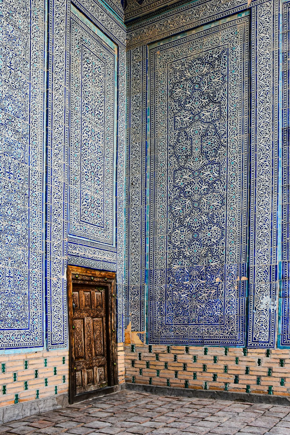 a room with a door and a tiled floor