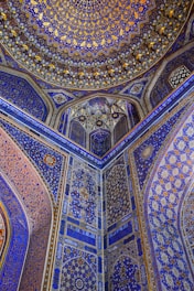 the ceiling of a building with blue and gold designs