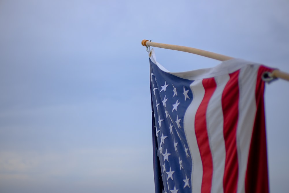 an american flag with a stick sticking out of it