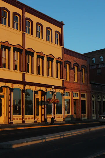 A charming historic building at 73 Cornhill, London, bathed in warm afternoon light.