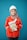 A person wearing a bright red industrial jacket with reflective stripes and a white safety helmet. They are holding a book titled 'Occupational Safety and Health Act' against a plain blue background. The person is smiling and the jacket has a logo on the chest.
