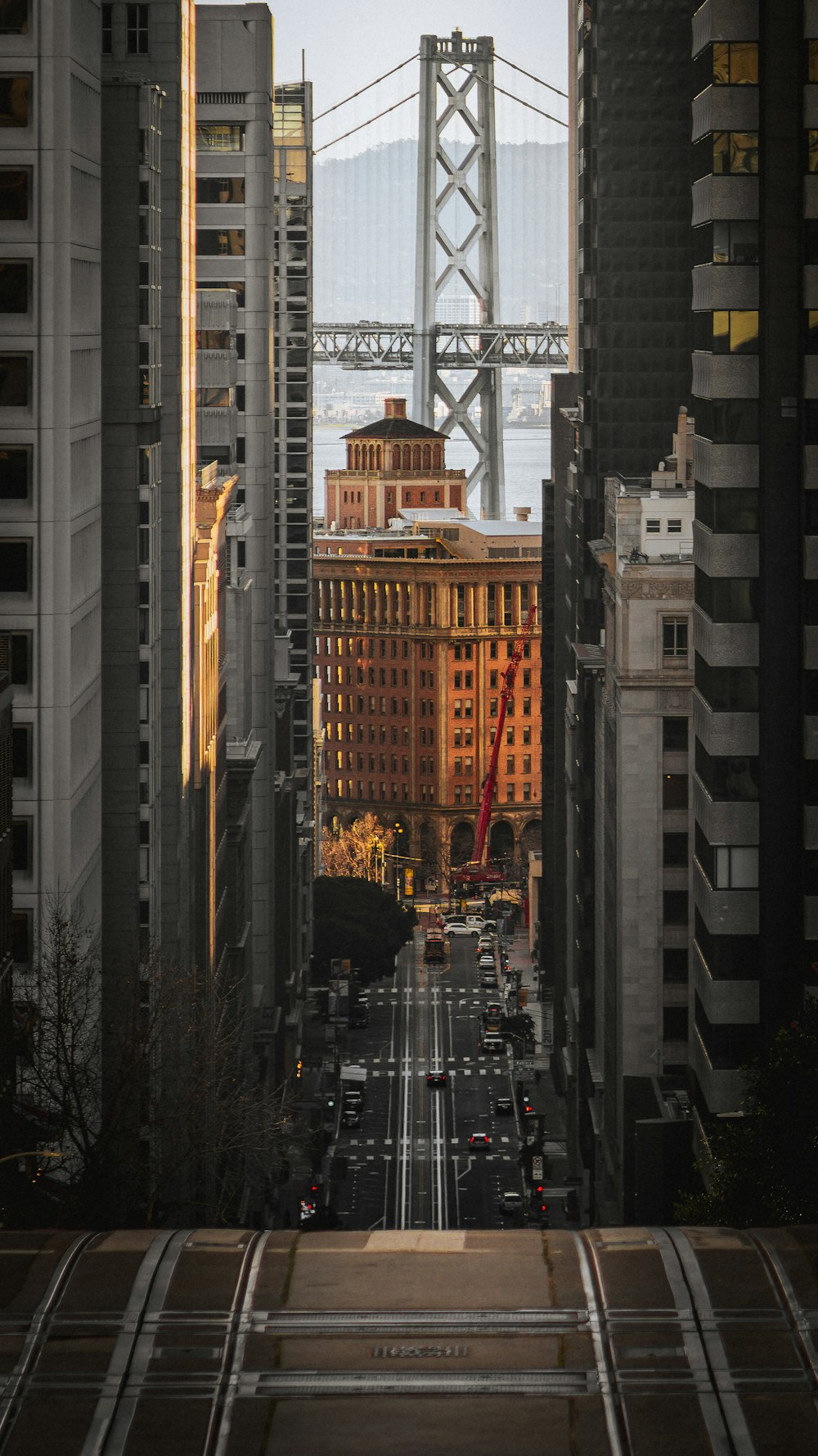 a view of a city with a bridge in the background