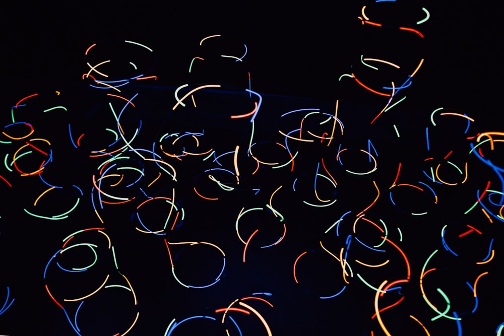 a bunch of colorful lights in the dark