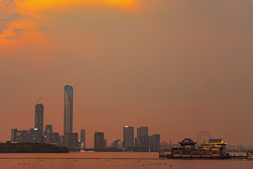 a large body of water with a city in the background