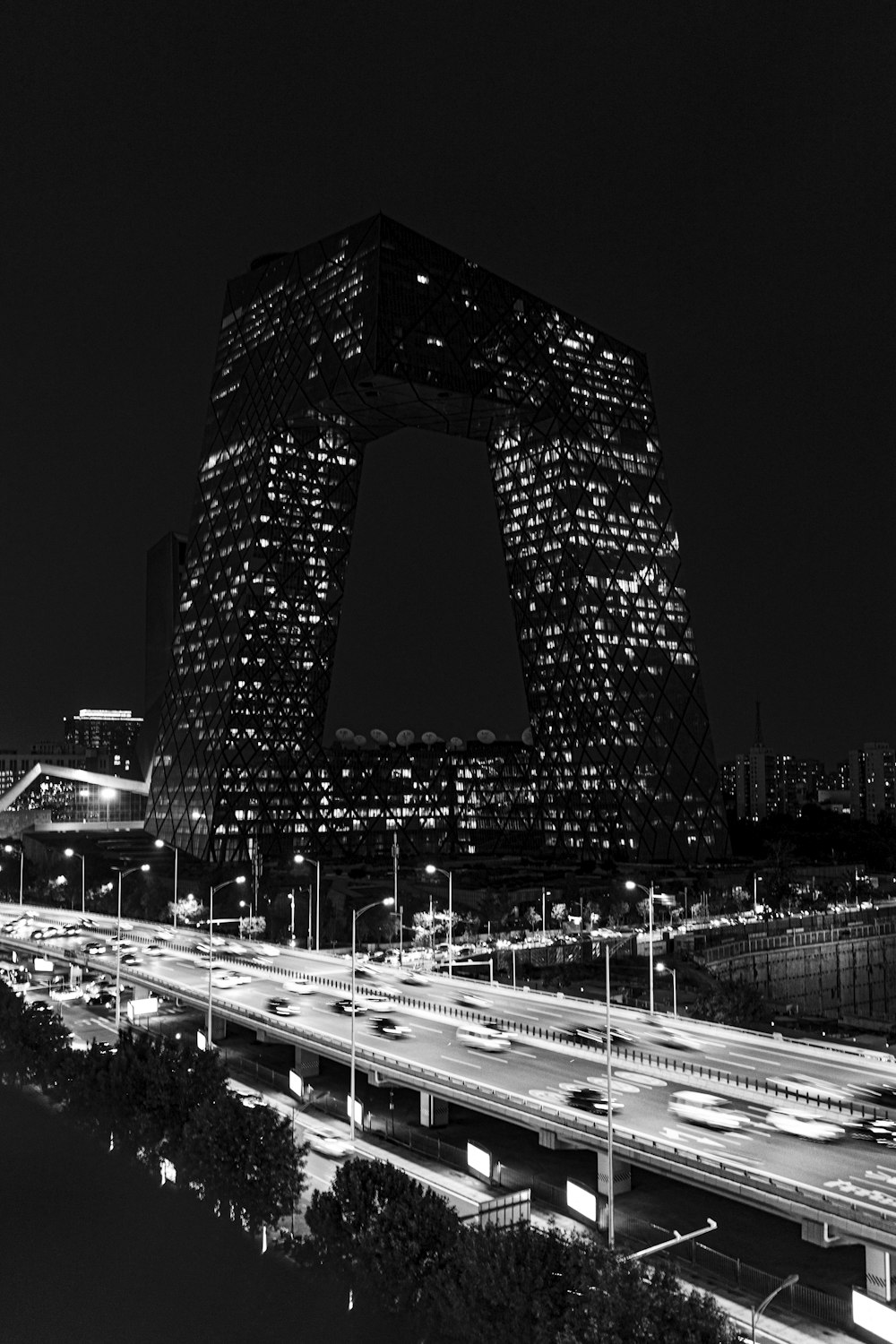 a black and white photo of a city at night