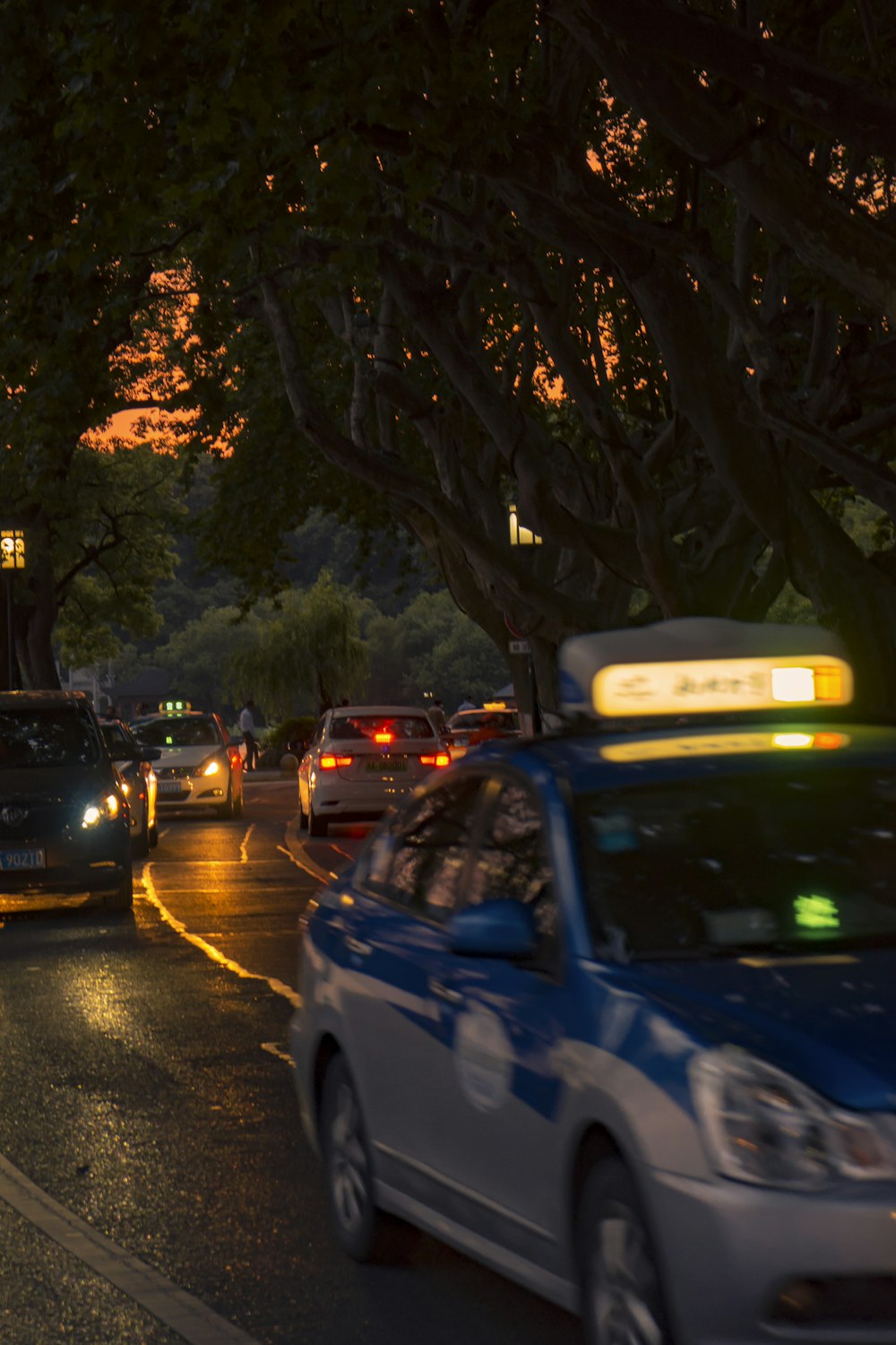 a busy city street at night with a lot of traffic