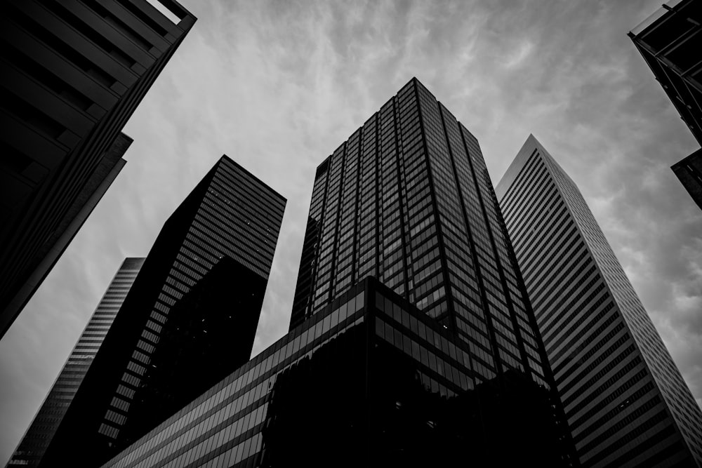 a black and white photo of tall buildings