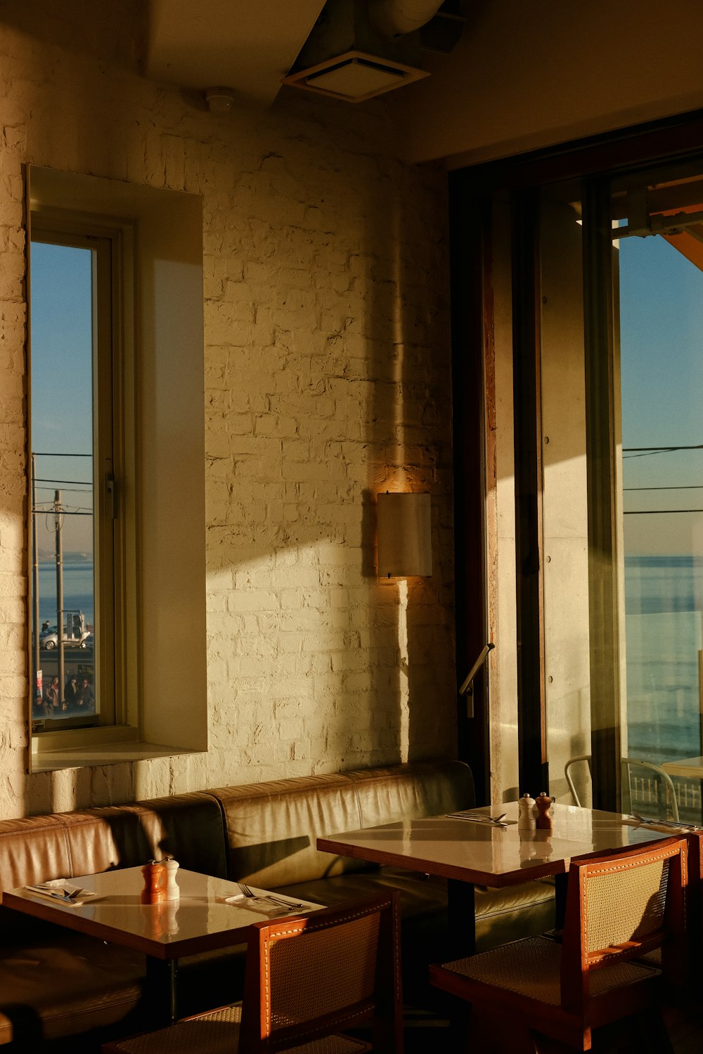 a restaurant with a view of the ocean