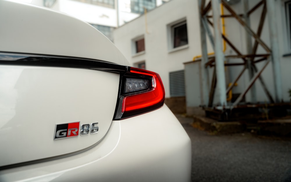 a close up of the tail lights of a white car