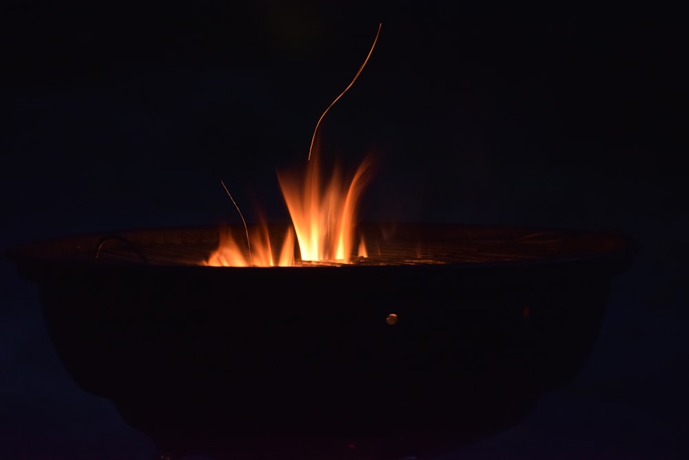 a fire pit lit up in the dark