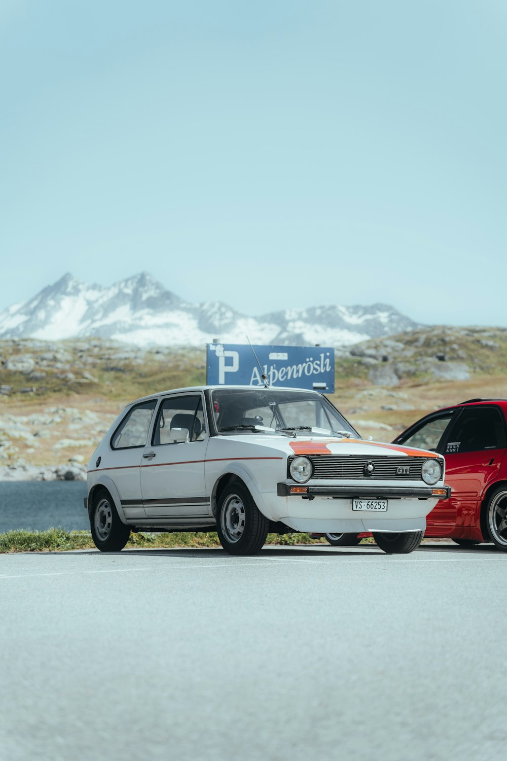 a couple of cars parked next to each other