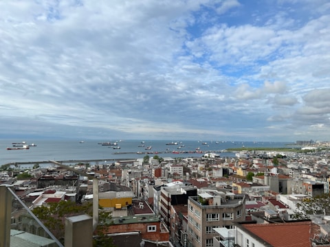 A panoramic view of a fleet of ships at sea.