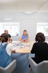 An engaging photo of a team meeting discussing a case.