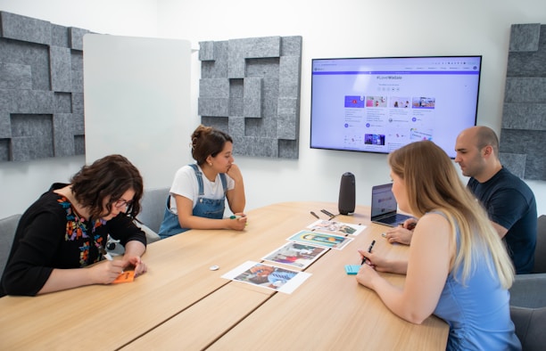 A professional team discussing intellectual property strategies around a conference table.