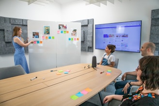 a group of people sitting around a conference table