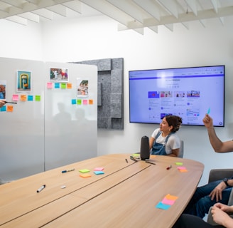 a group of people sitting around a conference table