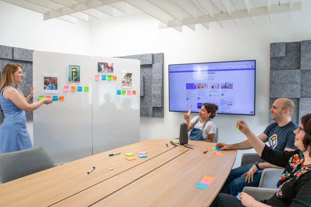 a group of people sitting around a conference table