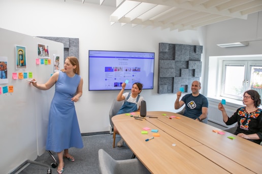 a group of people sitting around a conference room
